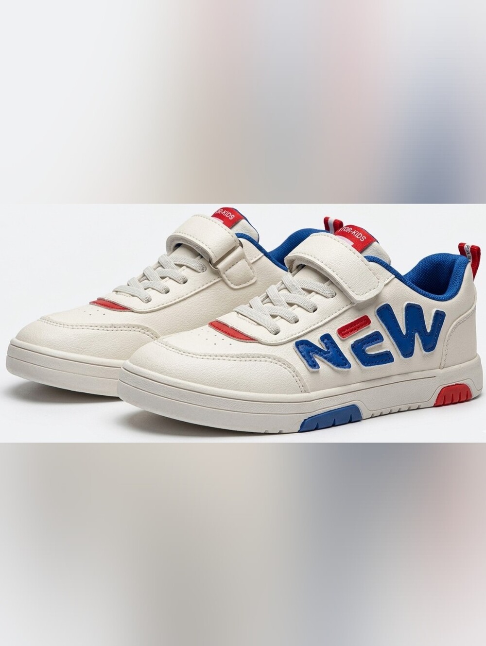 Kids Cream Sneakers with Blue 'NEW' Lettering and Red Accents